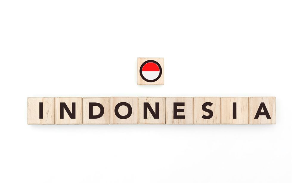 Wooden blocks bearing the name and flag of Indonesia. Indonesian and Austral Culture, national identity, travel, and geography in a copy space design.
