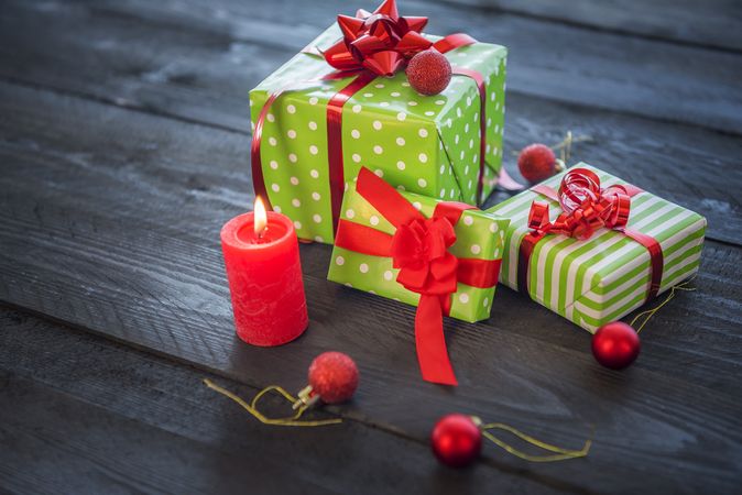 Presents wrapped in green paper with red bows