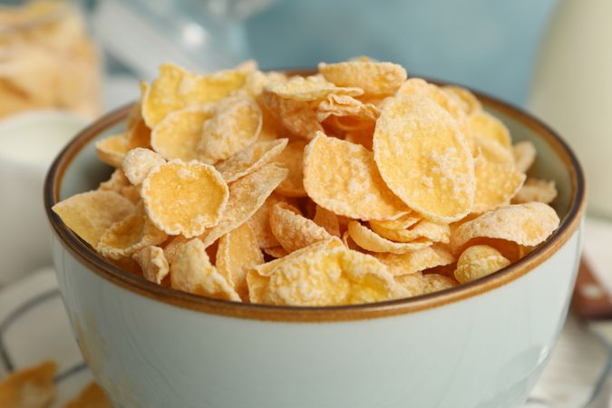 Bowl with tasty honey muesli, close up