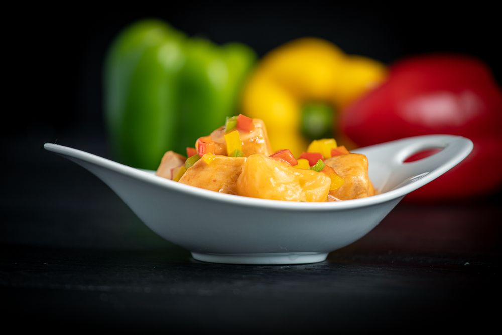 Juicy Marmitako dashi with peppers on table