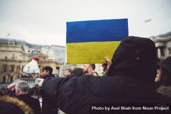 London, England, United Kingdom - March 5 2022: Man with cardboard Ukrainian flag 0JOWn5
