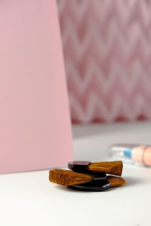 Cosmetic pencils:, make up blue eyeliner pencil, modern background with pink chevron reliefs. make up concept