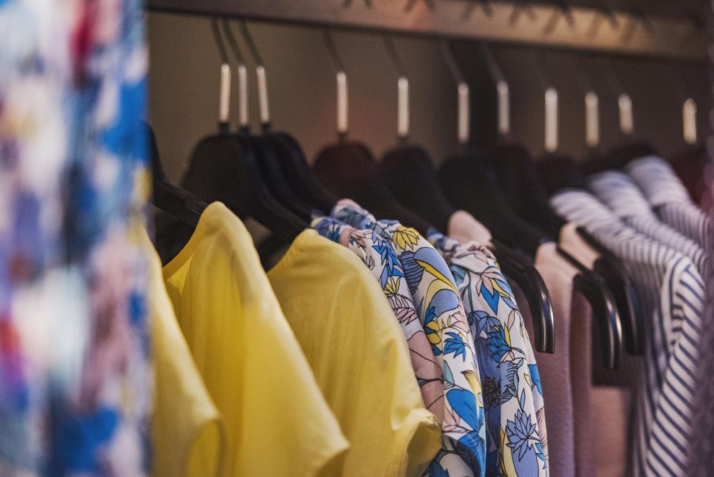 Clothes rack of summer shirts in fashion store