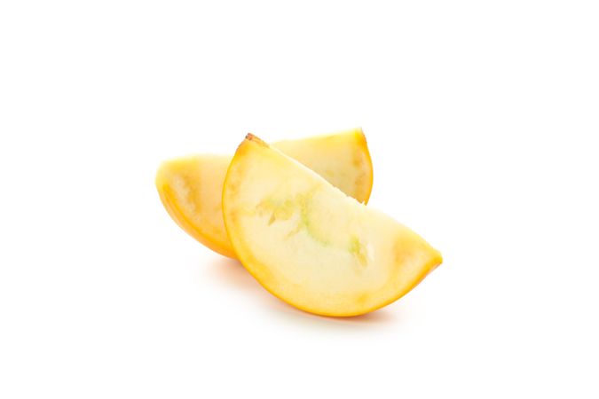 Fresh zucchini slices isolated on blank background