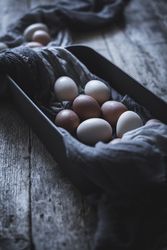 Raw eggs on tablecloth