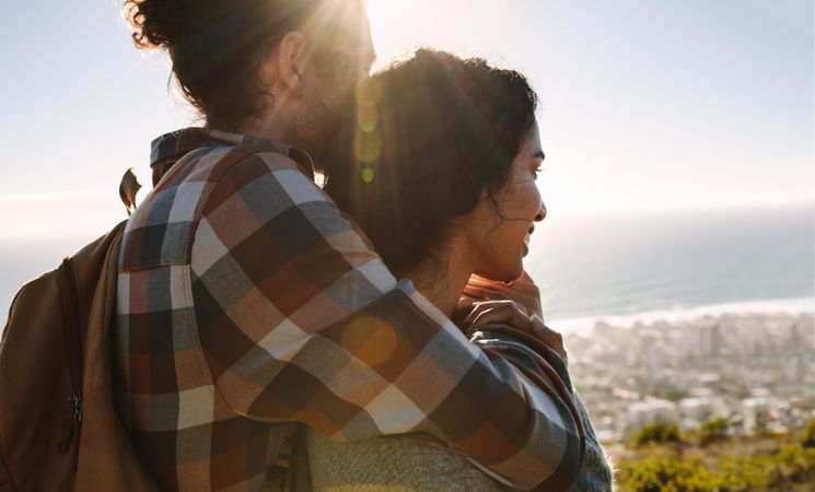 Couple looking at view from mountain