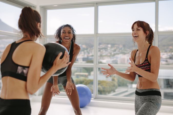 Sporty women exercising with medicine ball