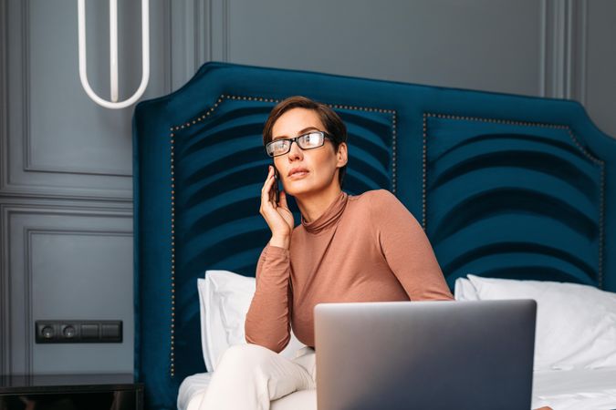 Businesswoman working from hotel room