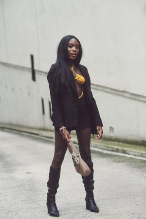 London, England, United Kingdom - September 18 2021: Full body shot of woman in blazer and skirt