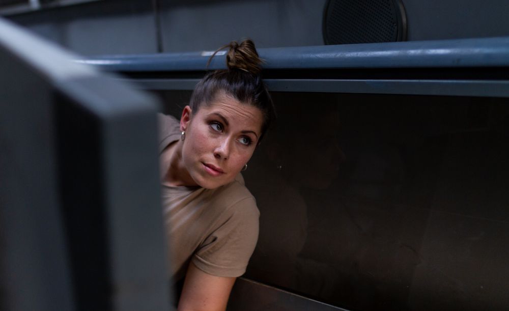 Military woman inside modern vehicle