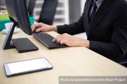 Male employee on computer keyboard in office 5zDyjb