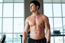 Athletic men with shit off in gym