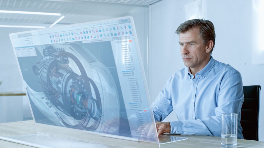 In the Near Future Professional Engineer Works on Transparent Computer Display, Constructing 3D Model of the Metal Detail.