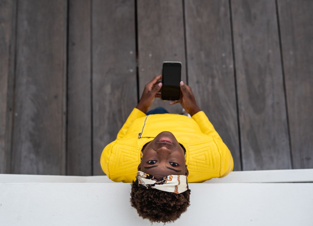 Tranquil female using mobile phone