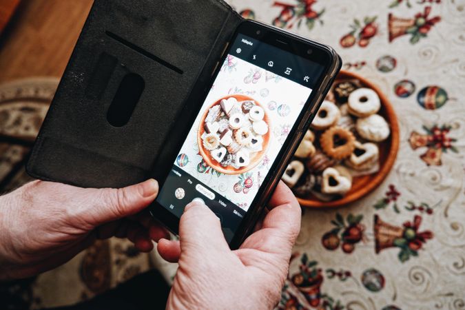 Person taking picture of cookies with smartphone