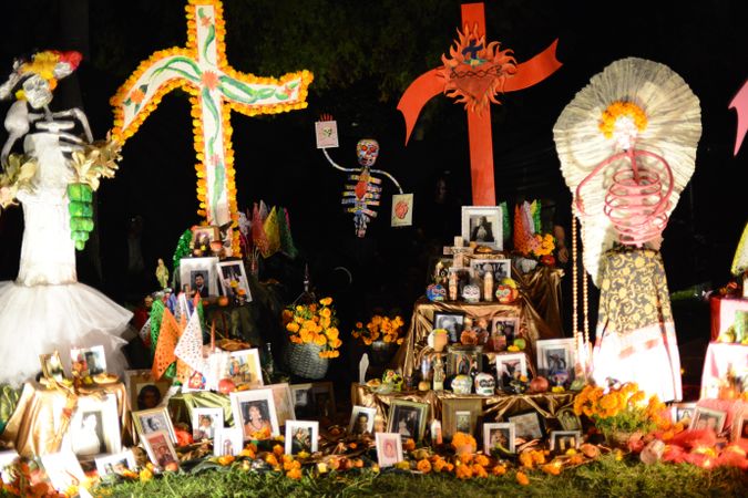 Altar at Day of the Dead with crosses and photos
