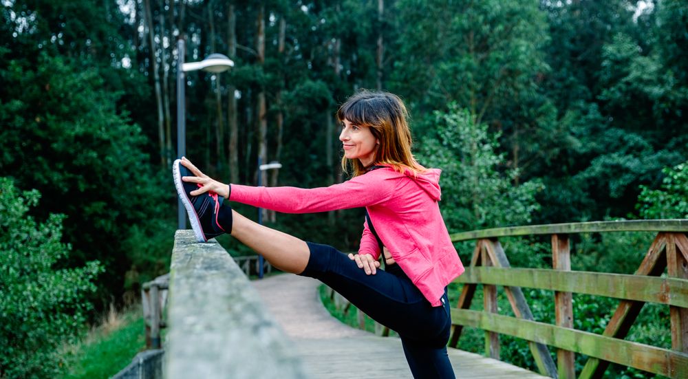 Athlete woman doing leg stretch