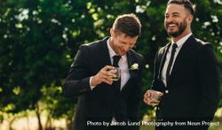 Groom and groomsmen partying after wedding 48eJ7b