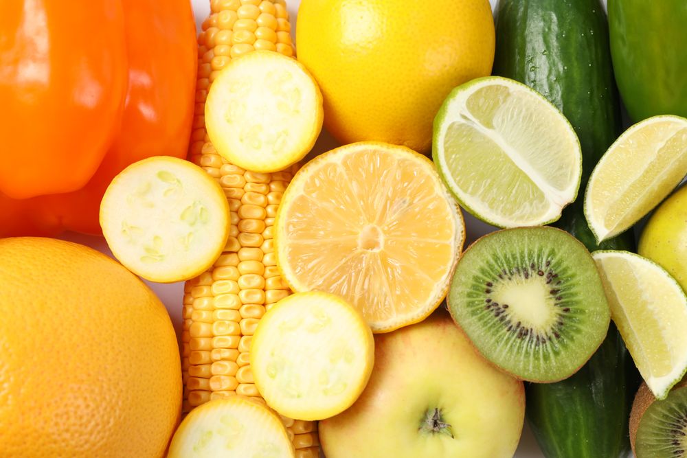 Different vegetables and fruits on blank background, top view