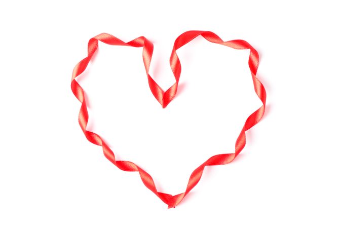 Red ribbon heart isolated on blank background