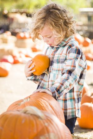 Little Boy Holding His Pumpkin
