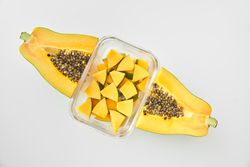 Glass full of ripe papaya slices