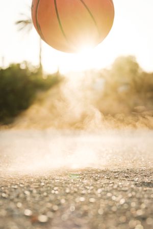 Ball bouncing on ground in daylight