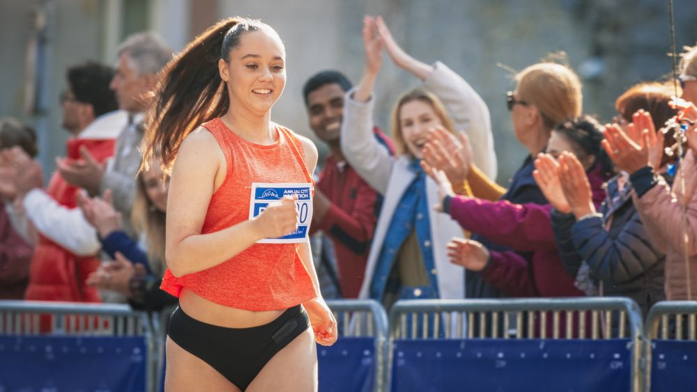 Portrait of a Woman Running and Participating in a Marathon in a Park.