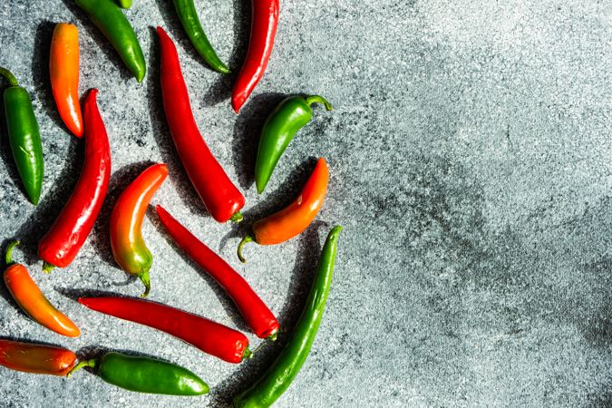 Spicy peppers on grey kitchen counter with space for text