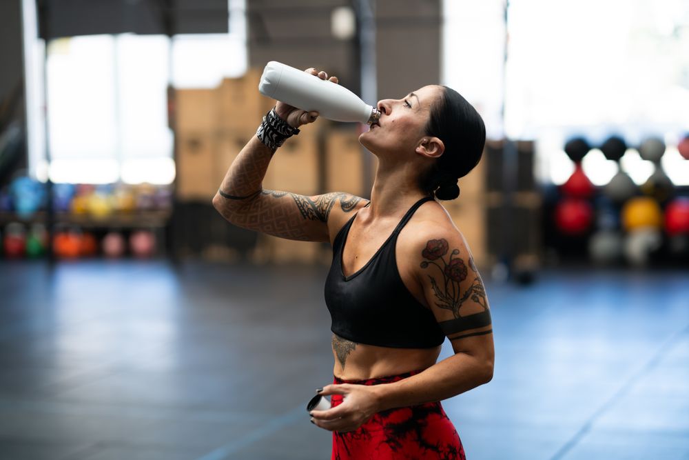 Woman drinking from water bottle
