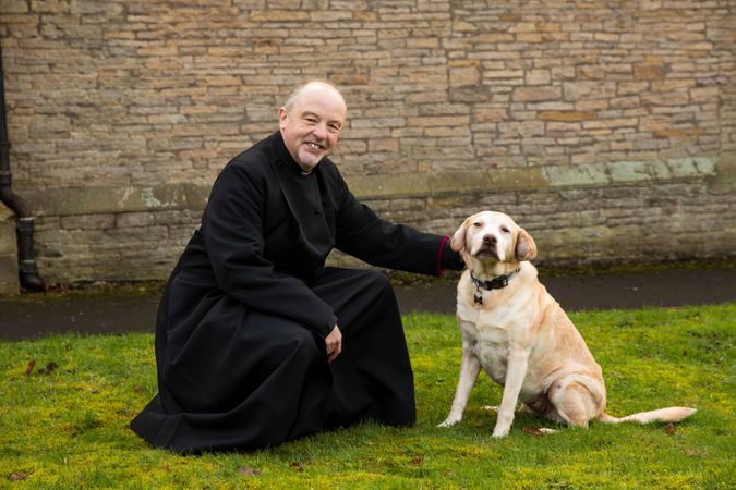 Vicar with labrador