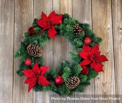 Holiday Poinsettia Christmas wreath on rustic wood 4BGeXb