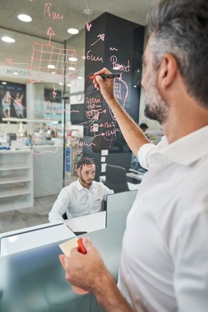 Man working on project of new protective mask