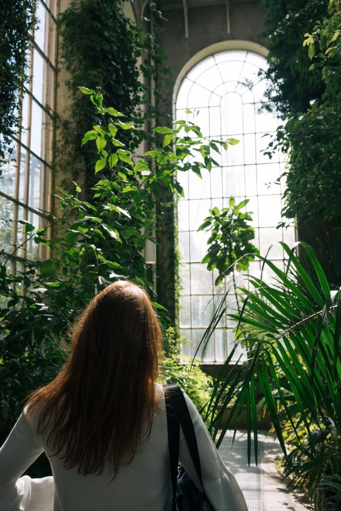 Woman walking in greenhouse