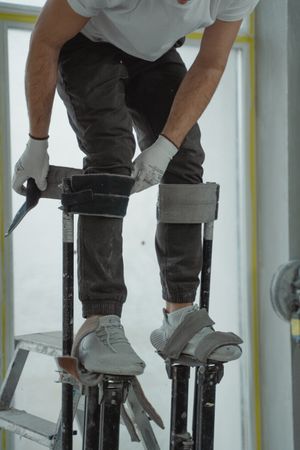 Tradesman beside ladder