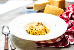 Italian homemade pasta served with checkered napkin