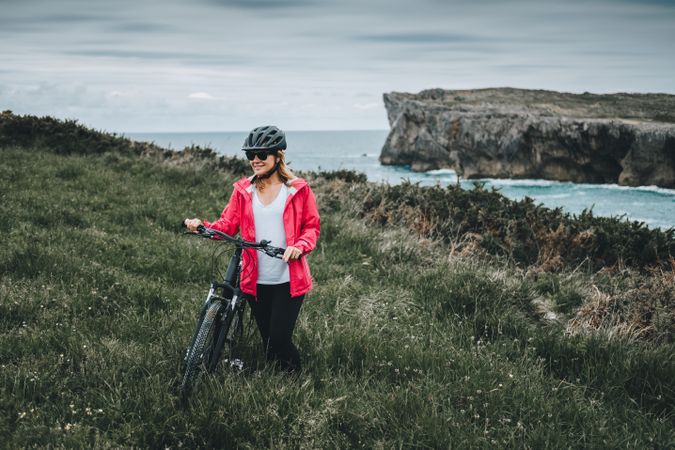 Female bicyclist on rocks