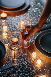 Wine glasses being set for dinner