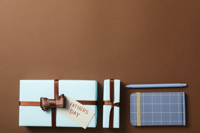 Father's day concept, gifts and greetings, on a brown background.