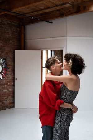 Two young women hugging and smiling at each other