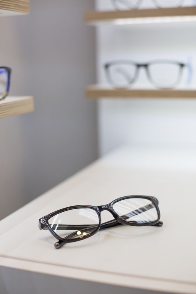 glasses on a shelf in a store
