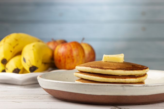 Delicious pancakes with butter and honey.