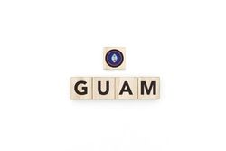 Wooden blocks bearing the name and flag of Guam.