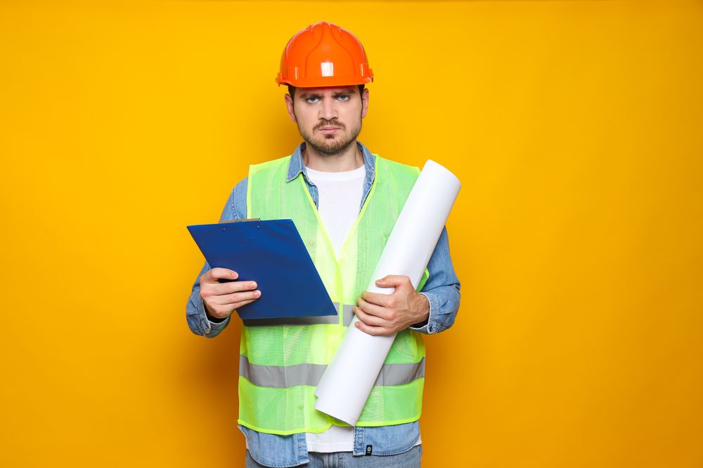 Young man civil engineer in safety hat