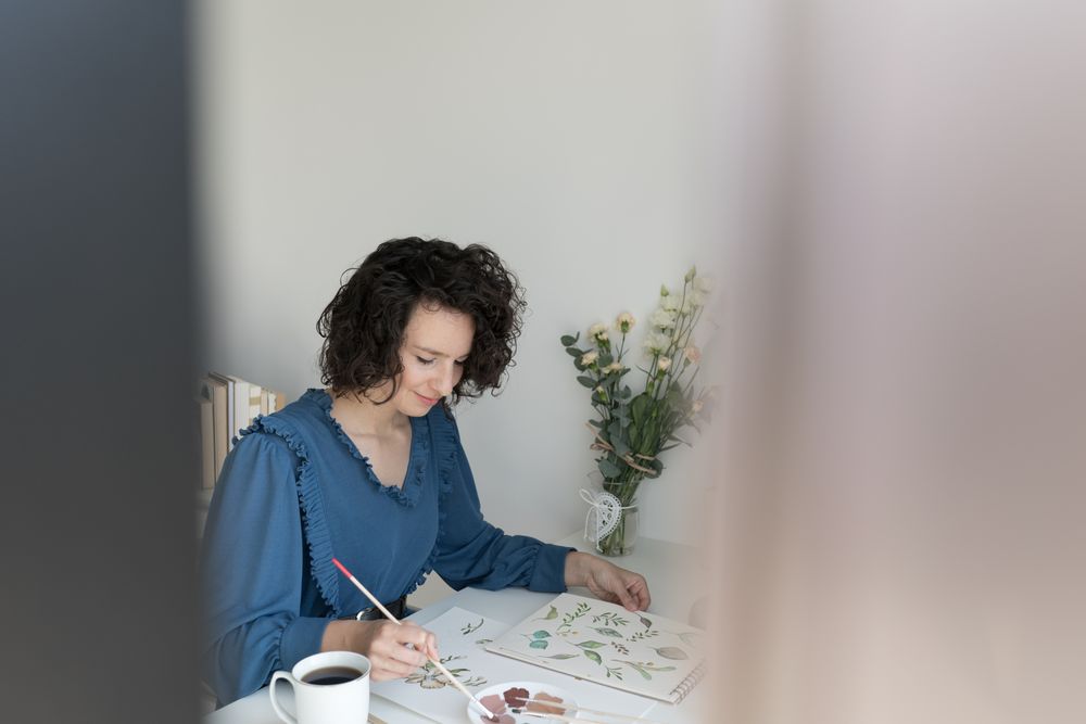 Woman painter working at home