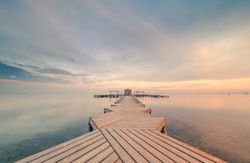 Wooden pier on cloudy evening