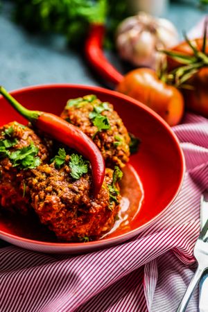 Close up of bowl of spicy meat balls