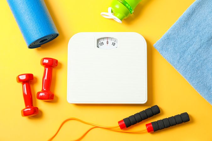 Flat lay composition with healthy lifestyle accessories on color background
