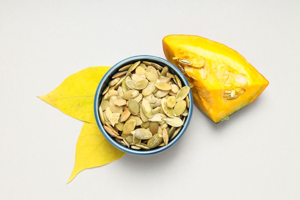 Cooking ingredients for fall season - pumpkin seeds, pumpkin