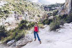 Female traveler in mountainous terrain